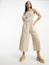 ASOS DESIGN strappy high neck shirred jumpsuit in gingham