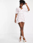 In The Style x Perrie Sian puff sleeve frill wrap detail mini dress in white ditsy print