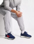 New Balance 327 trainers in navy and red