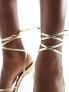 ASOS DESIGN Nightly strappy tie leg high sandals in gold