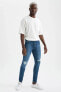 Фото #7 товара Super Skinny Fit Normal Bel Dar Paça Yırtık Detaylı Jean Pantolon