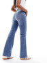 Фото #5 товара & Other Stories low rise flared jeans in mid blue wash