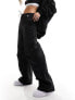 Фото #1 товара Calvin Klein Jeans parachute pants in black