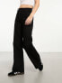 & Other Stories high waist flared leg jeans with button front detail and patch pockets in black