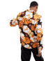 ASOS DESIGN relaxed shirt with 70s collar in orange and brown floral print