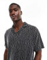 ASOS DESIGN relaxed revere polo in black textured stripe