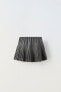 Pleated buttoned skirt