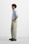 TEXTURED PLEATED TROUSERS