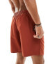 ASOS DESIGN swim shorts in mid length in rust