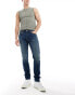 Фото #1 товара Levi's 512 slim taper jeans in mid blue