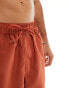 ASOS DESIGN swim shorts in mid length in rust