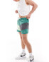 Фото #2 товара Nike Swimming Multi Logo Vortex 5 inch volley colourblock swim shorts in bicoastal green