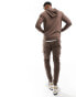 ASOS DESIGN skinny tracksuit with hoodie and skinny cargo jogger in washed brown