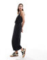 Monki drapey wide leg cami jumpsuit with wrap front in black