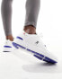 ON The Roger Spin trainers in white and blue