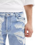 ASOS DESIGN skinny jeans with heavy rips in light wash blue