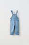 Denim dungarees with daisies