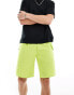 The North Face logo pocket shorts in lime