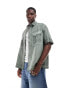 ASOS DESIGN oversized washed cargo shirt in green