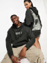 ASOS DESIGN unisex license oversized hoodie with Nirvana Licence print in charcoal