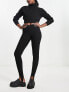 Lindex ribbed merino wool base layer leggings with stirrup detail in black