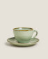 Porcelain teacup with antique finish rim