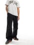 Фото #1 товара Tommy Jeans parachute trousers in black