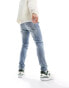 ASOS DESIGN skinny jeans in light blue wash with abrasions