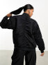 Nike Varsity reversible bomber jacket in black