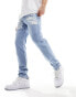 ASOS DESIGN skinny jeans with heavy rips in light wash blue