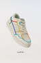 Minimalist lace-up sneakers with multicoloured trim