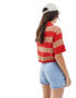 ASOS DESIGN knitted polo top in plated rib in stripe in orange and red