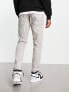 Levi's 502 tapered fit jeans in light grey with paint marks