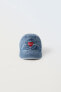 Denim cap with embroidered heart motif