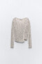 Asymmetric open-knit sweater