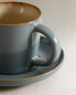 Teacup and saucer with contrast rim