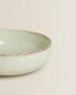 Porcelain bowl with antique finish rim