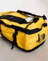 The North Face Base Camp small 50l duffel bag in yellow and black