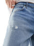 Lee Oscar relaxed tapered fit distressed jeans in mid vintage wash