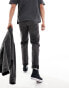 ASOS DESIGN tapered fit turn up jeans with pleats in washed black