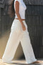 Flowing trousers with pleats