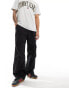 Фото #1 товара Tommy Jeans parachute trousers in black