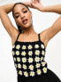 ASOS DESIGN crochet daisy playsuit in black