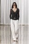 Semi-sheer creased-effect beaded jacket