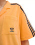 adidas Originals terry towelling resort shirt in hazy orange