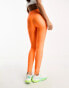 Under Armour branded legging in neon orange