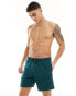 ASOS DESIGN swim shorts in mid length in forest green