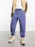 ASOS DESIGN oversized joggers in navy with collegiate multiplacement print