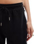 ASOS DESIGN straight leg joggers with side poppers in black