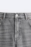Jeans with ripped-effect sides